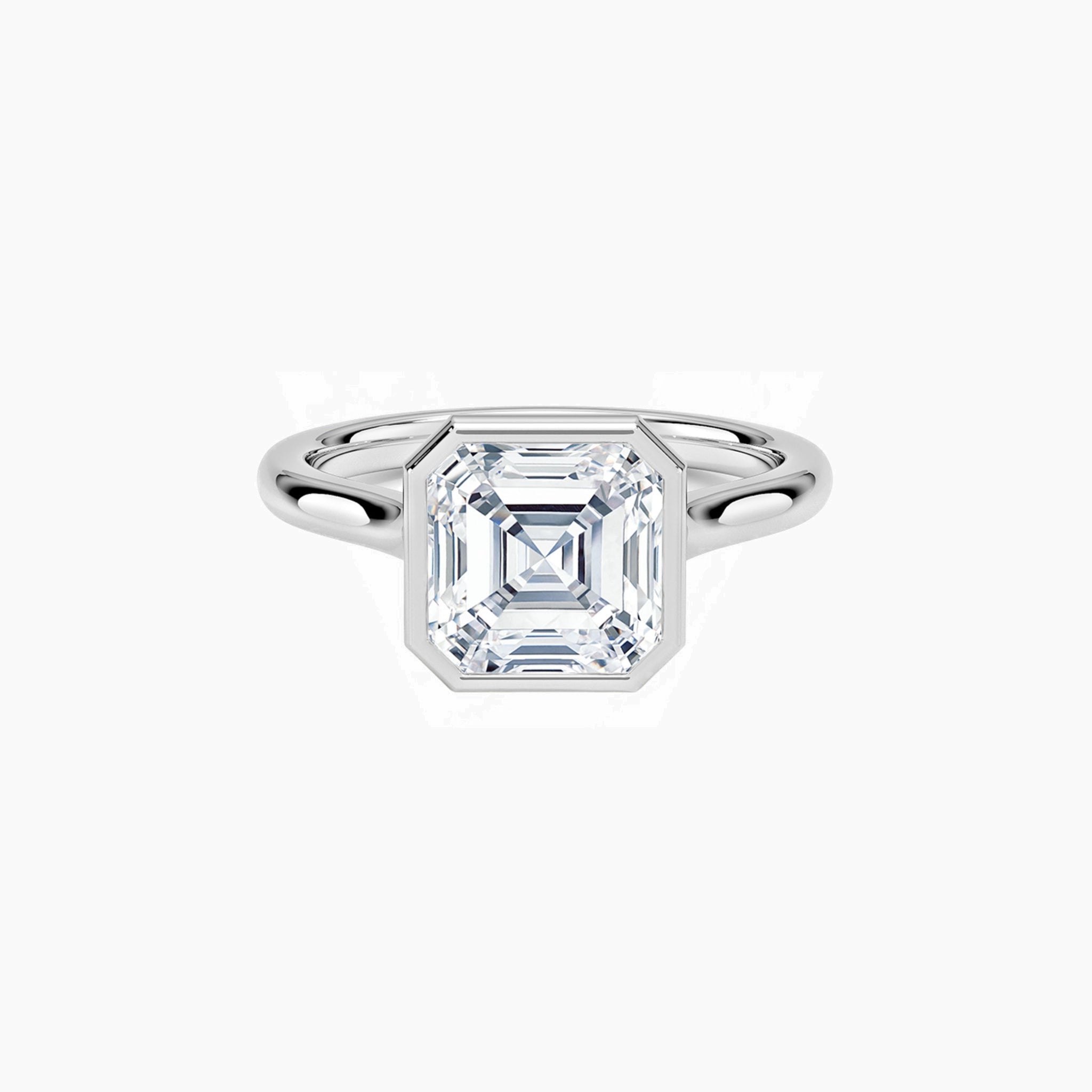 Asscher-cut moissanite bezel solitaire ring in white gold vermeil, front view.