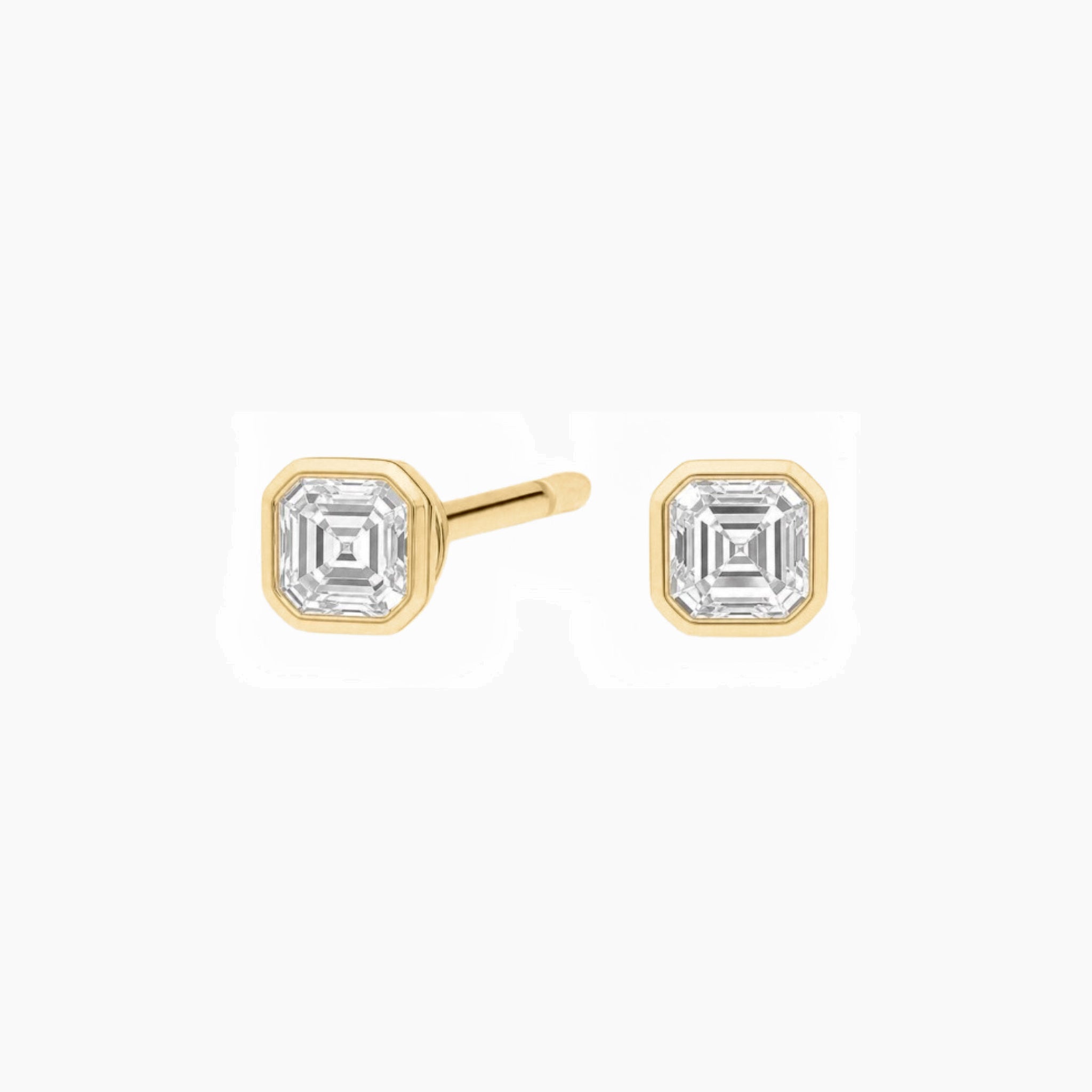 Asscher-cut moissanite bezel stud earrings in yellow gold vermeil, front and side views.