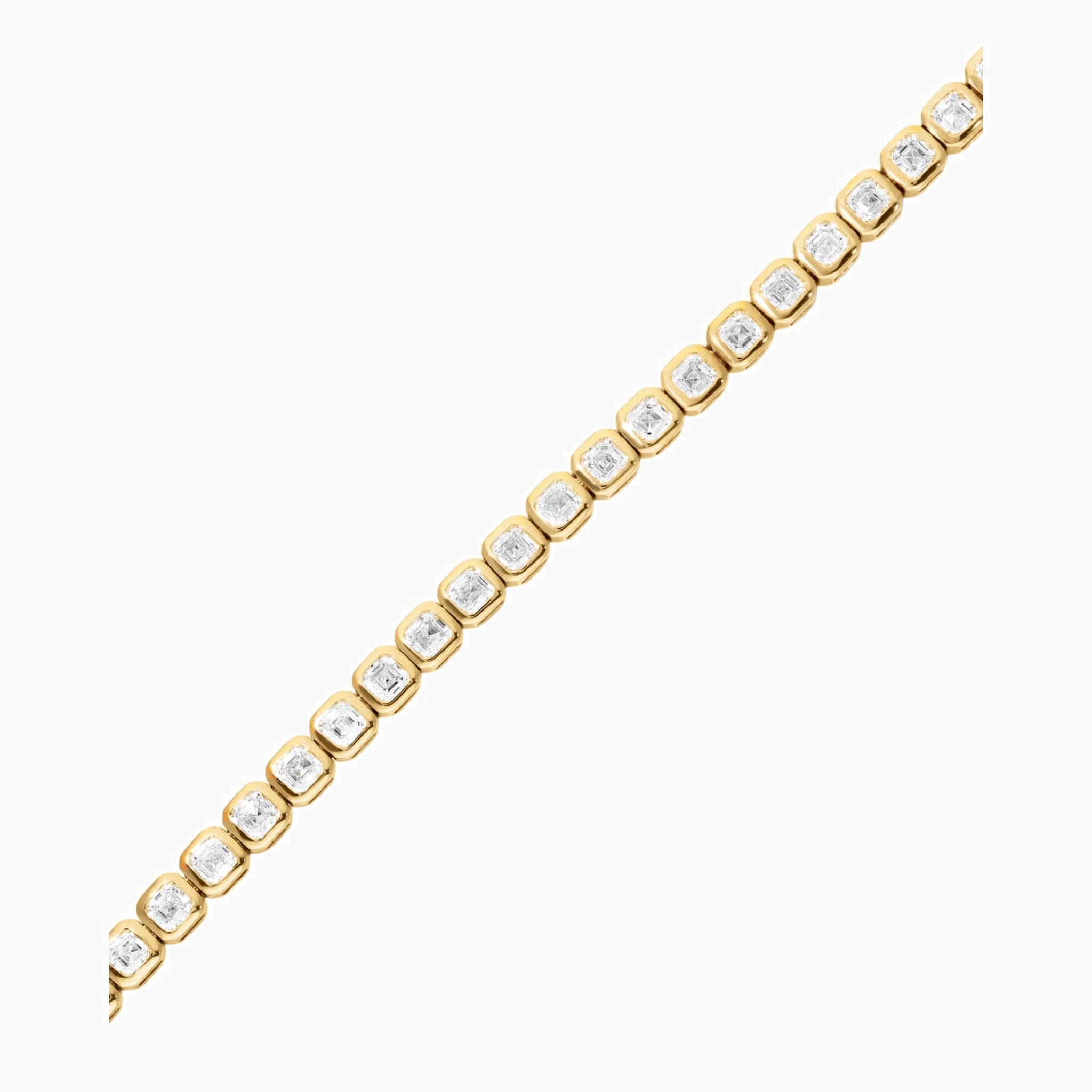 Asscher-cut moissanite bezel tennis bracelet in yellow gold vermeil, close-up detail.