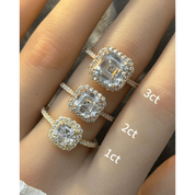 Asscher-cut moissanite halo ring with pavé band rings arranged across fingers for a carat-size comparison.