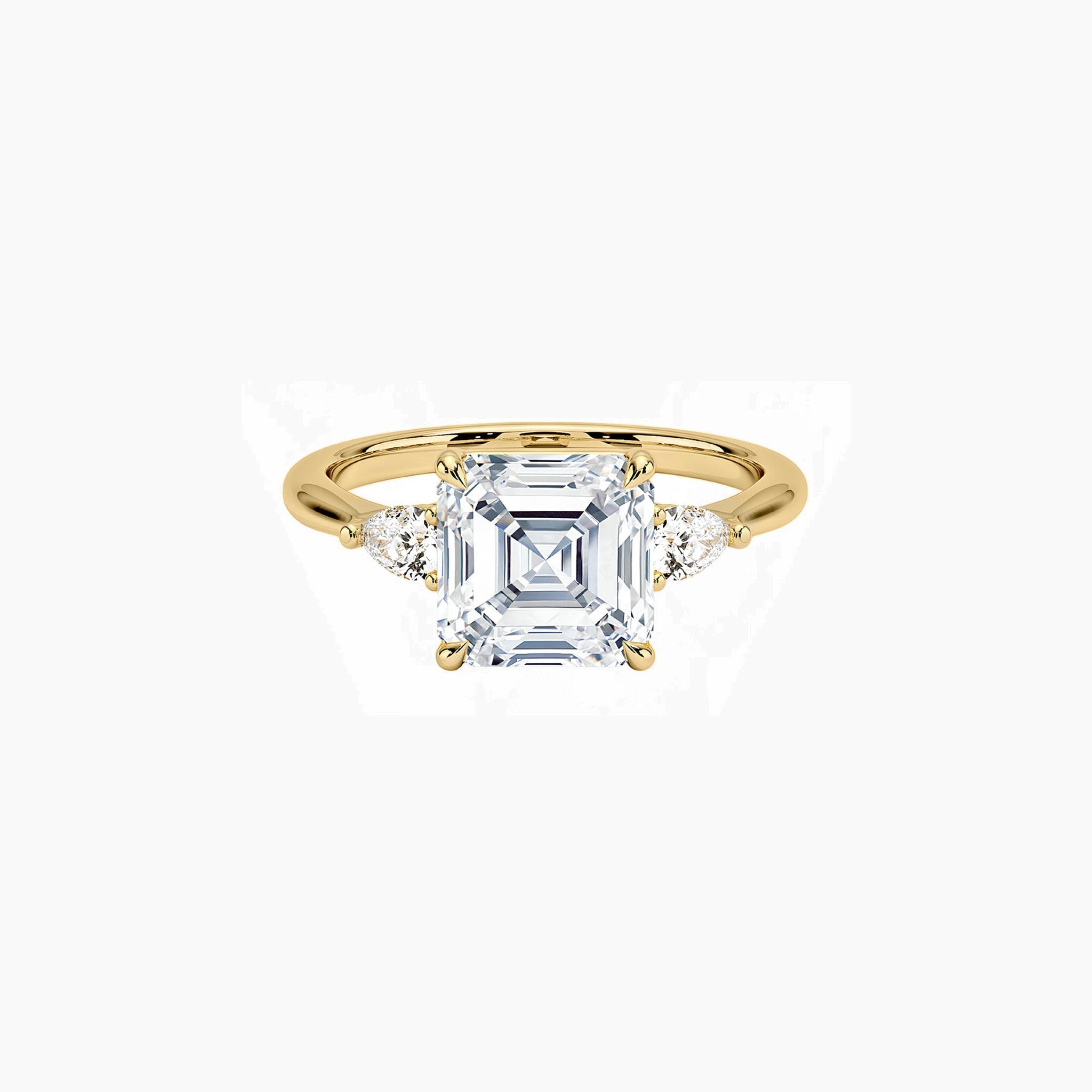 Asscher-cut moissanite three-stone ring in yellow gold vermeil, front view.