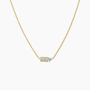 Baguette-cut and round-cut moissanite pendant necklace in yellow gold vermeil, front view.