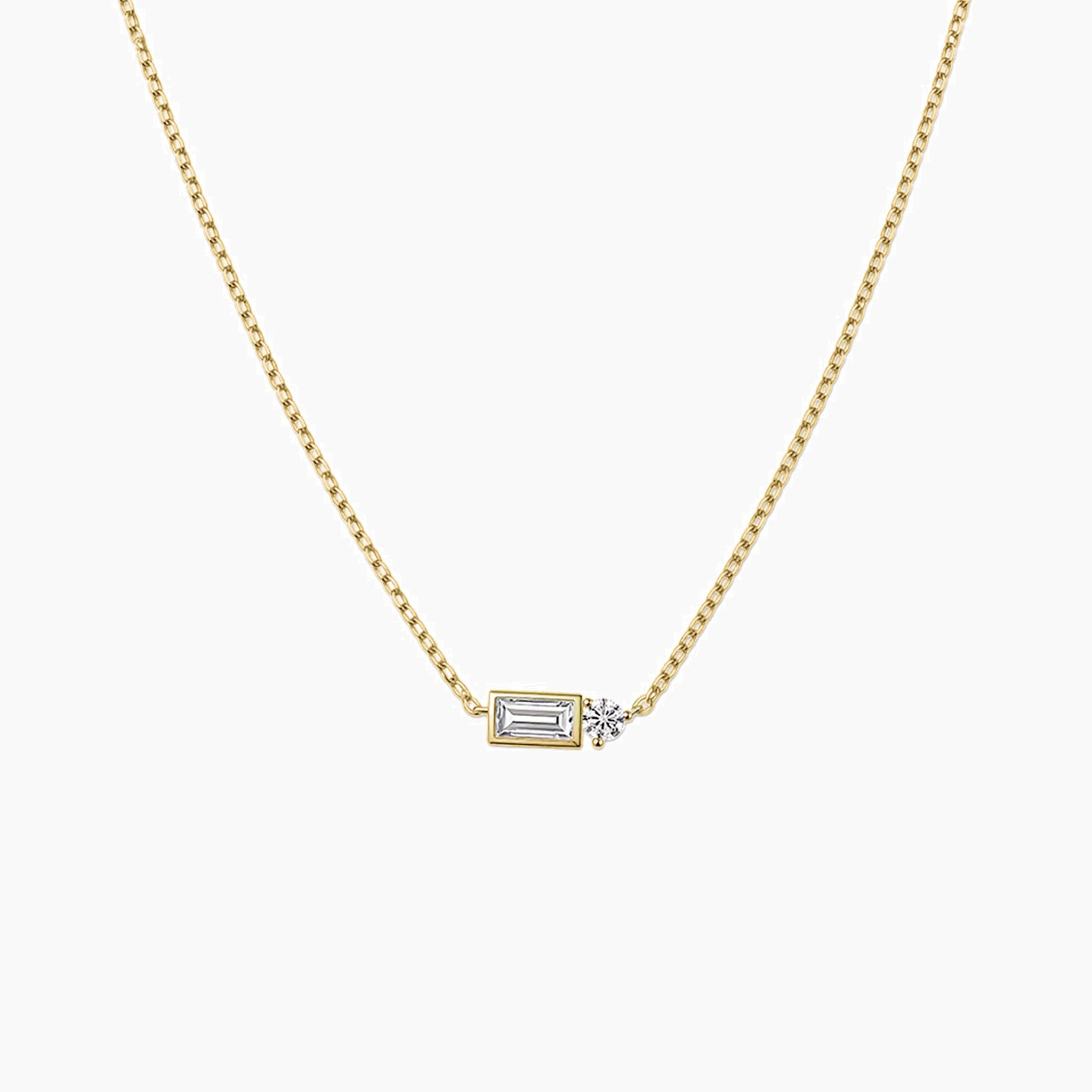 Baguette-cut and round-cut moissanite pendant necklace in yellow gold vermeil, front view.