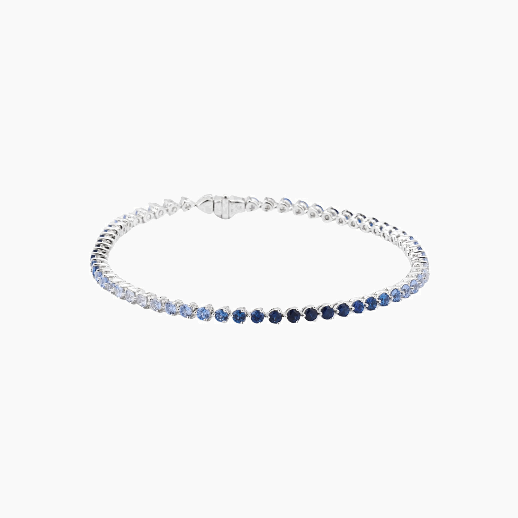 Blue ombré moissanite tennis bracelet in white gold vermeil, closed view.