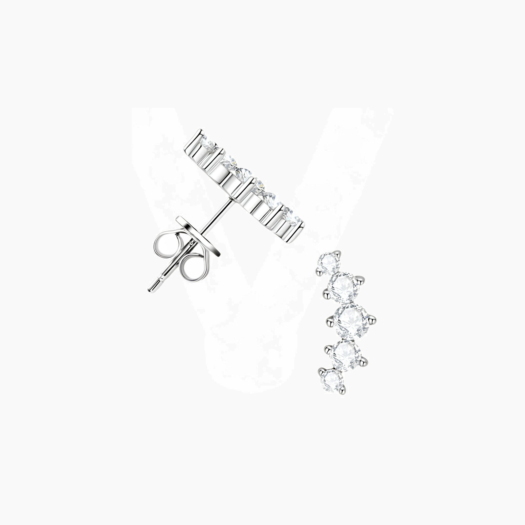 Curved moissanite stud earrings in white gold vermeil, angled view.