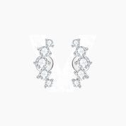 Curved moissanite stud earrings in white gold vermeil, front and side views.