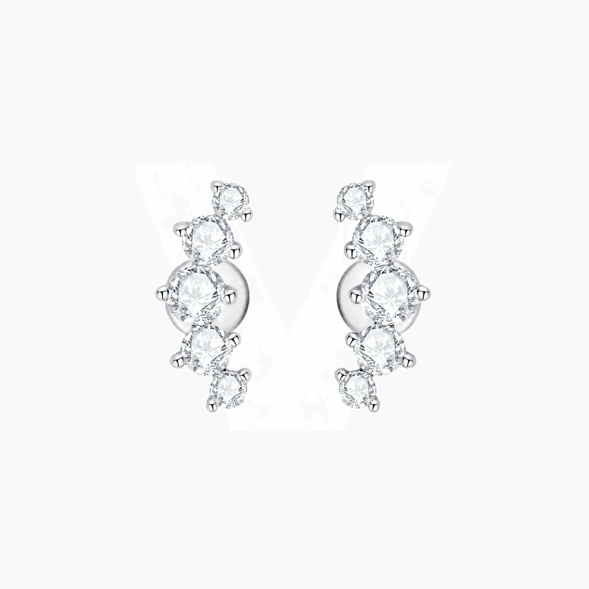 Curved moissanite stud earrings in white gold vermeil, front and side views.