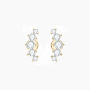 Curved moissanite stud earrings in yellow gold vermeil, front and side views.