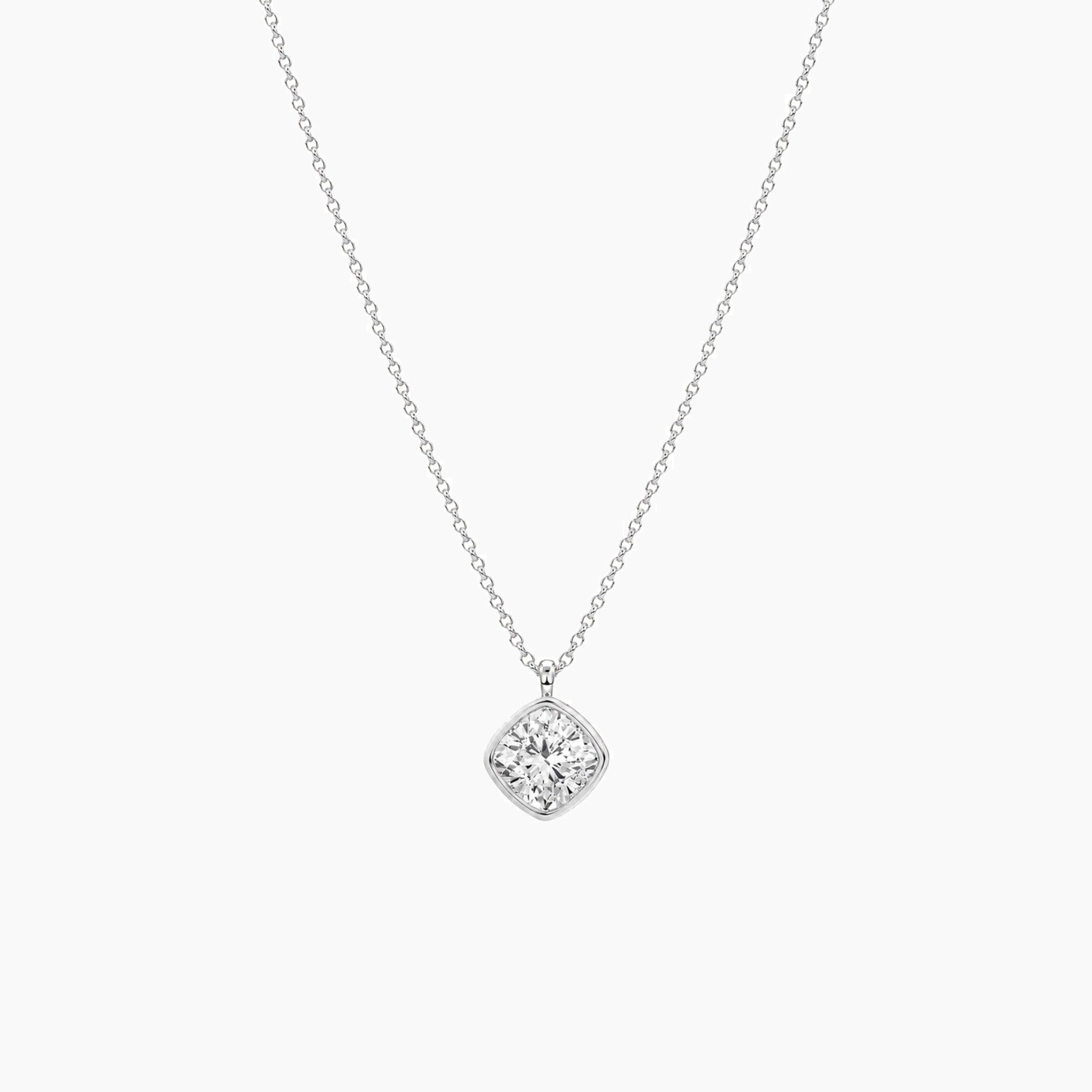 Cushion-cut moissanite bezel pendant necklace in white gold vermeil, full product view.