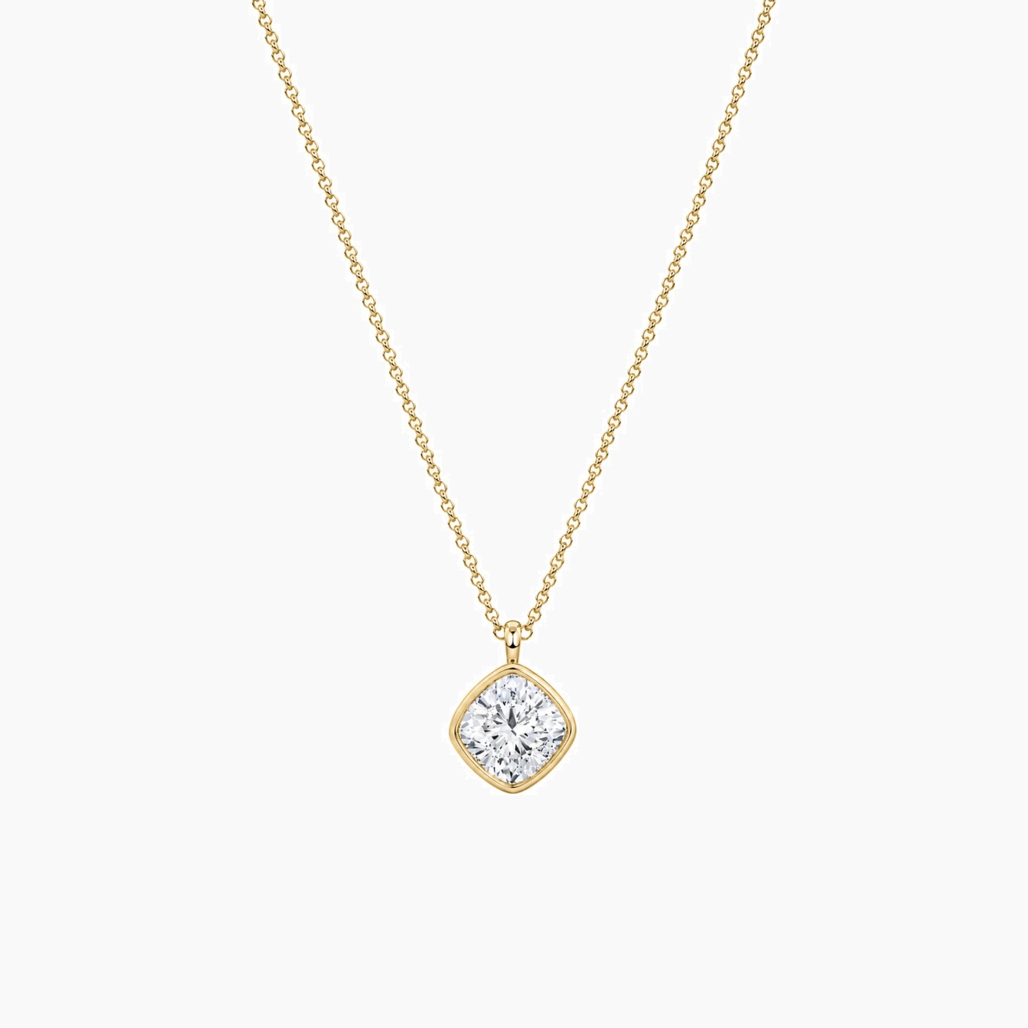 Cushion-cut moissanite bezel pendant necklace in yellow gold vermeil, full product view.