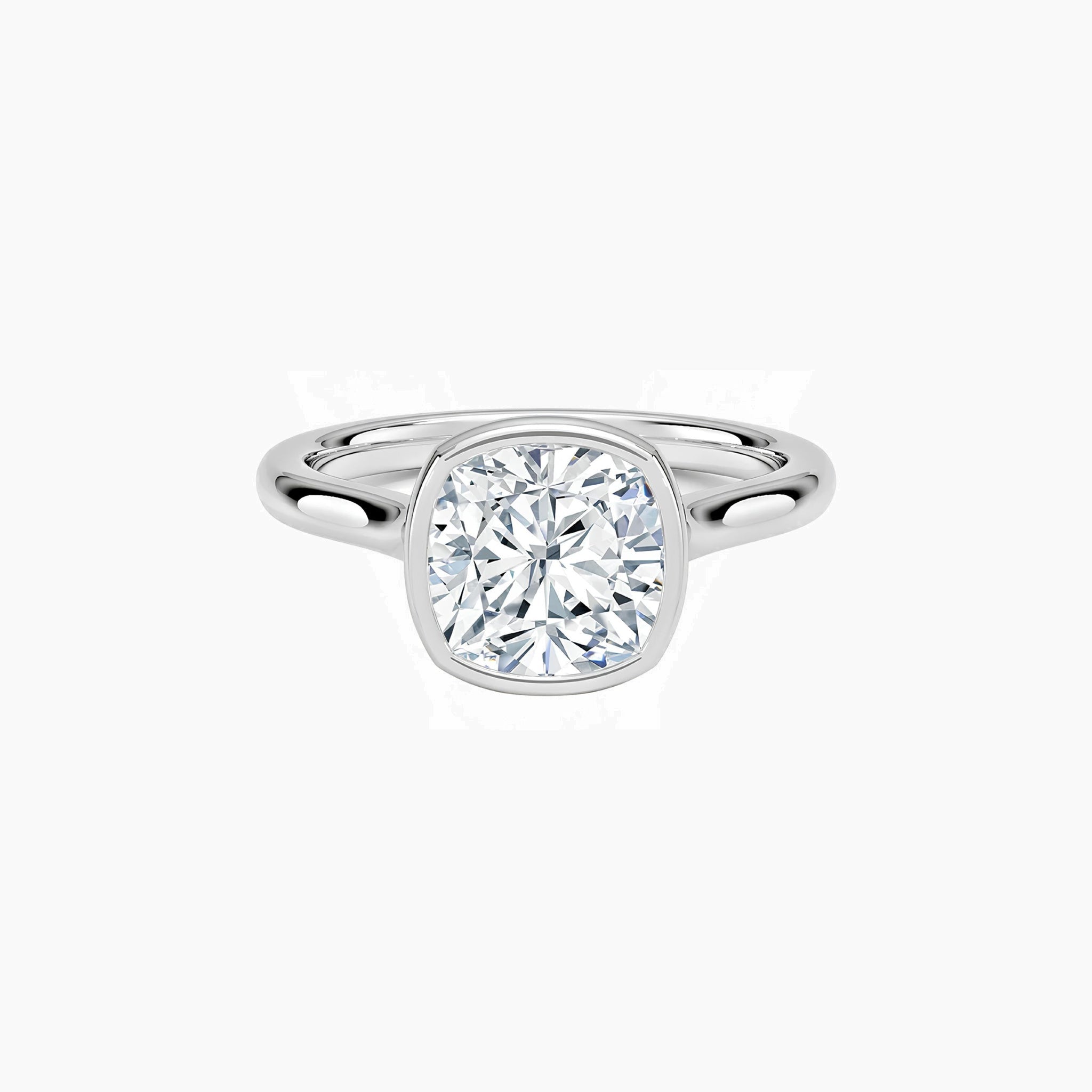 Cushion-cut moissanite bezel solitaire ring in white gold vermeil, front view.
