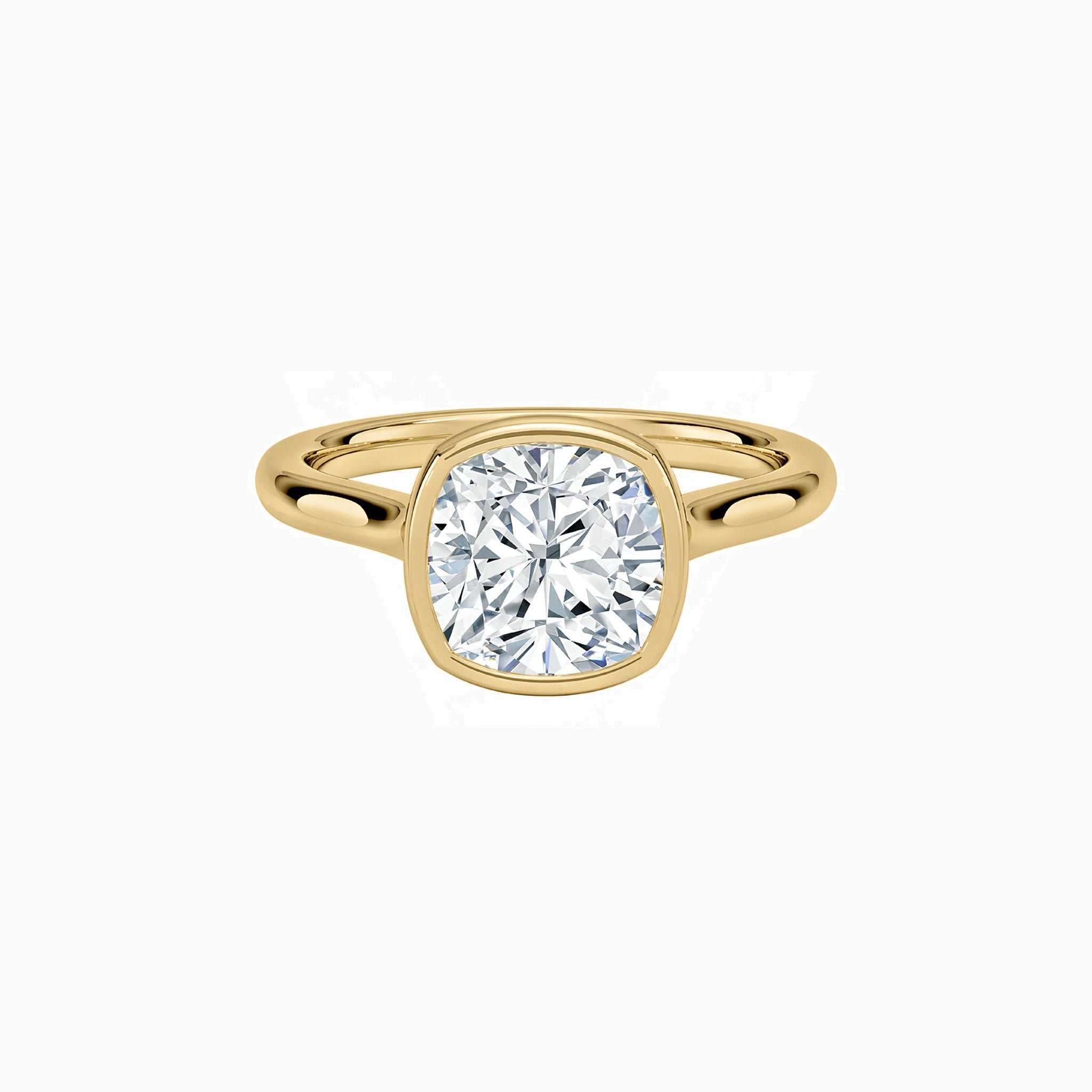 Cushion-cut moissanite bezel solitaire ring in yellow gold vermeil, front view.