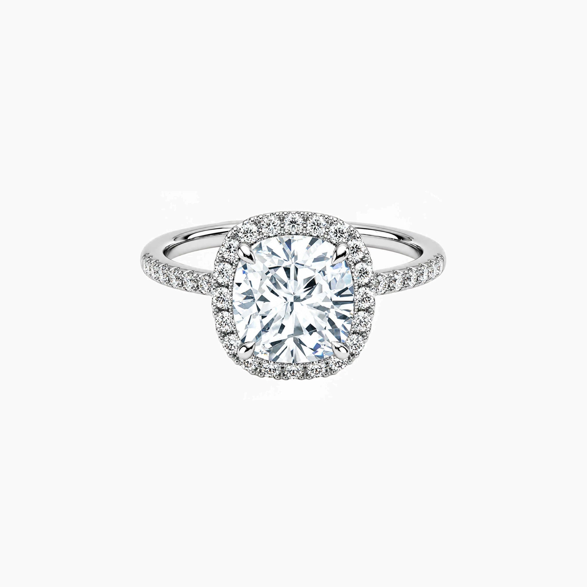 Cushion-cut moissanite halo ring with pavé band in white gold vermeil, front view.