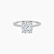 Cushion-cut moissanite hidden halo ring with pavé band in white gold vermeil, front view.