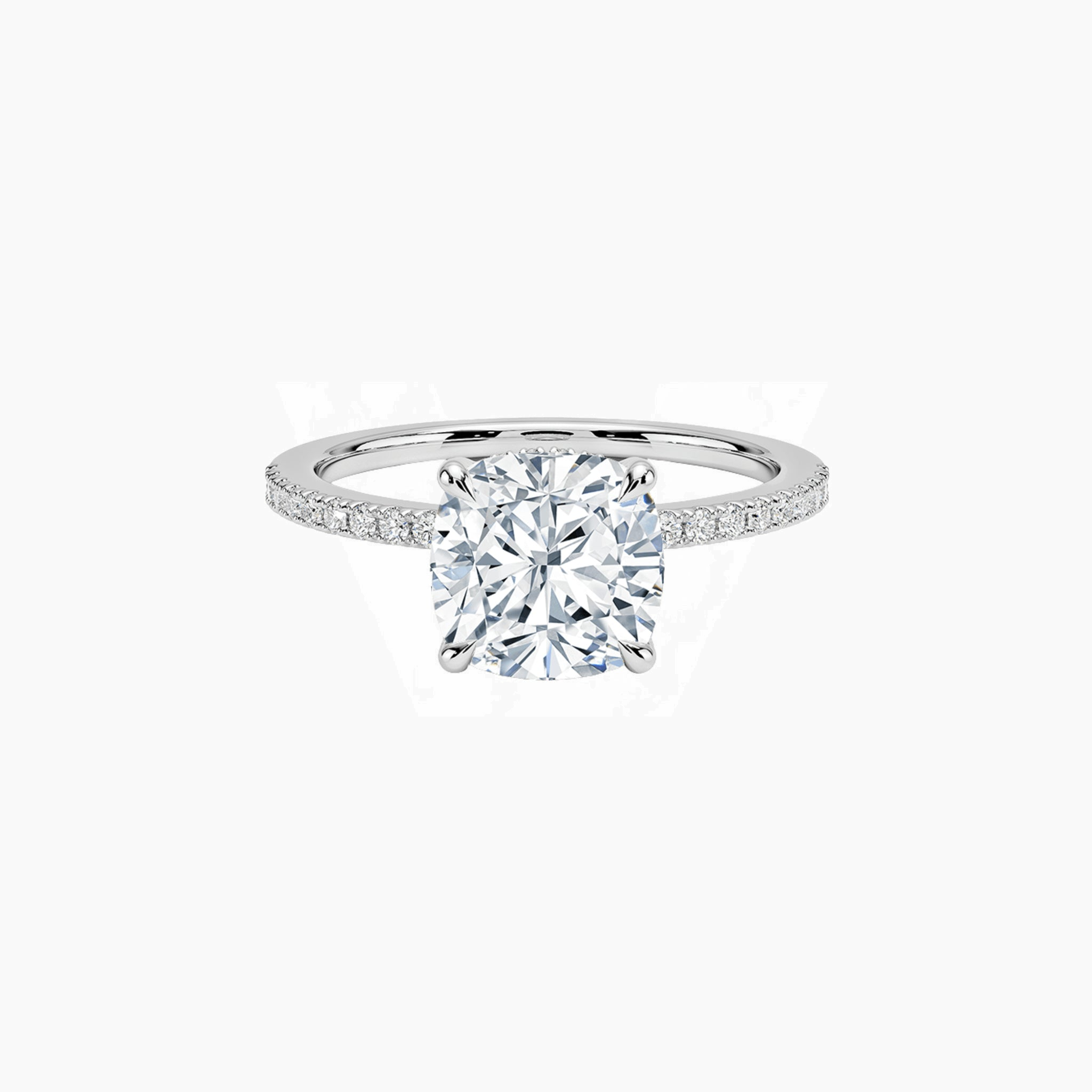 Cushion-cut moissanite hidden halo ring with pavé band in white gold vermeil, front view.