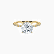 Cushion-cut moissanite hidden halo ring with pavé band in yellow gold vermeil, front view.