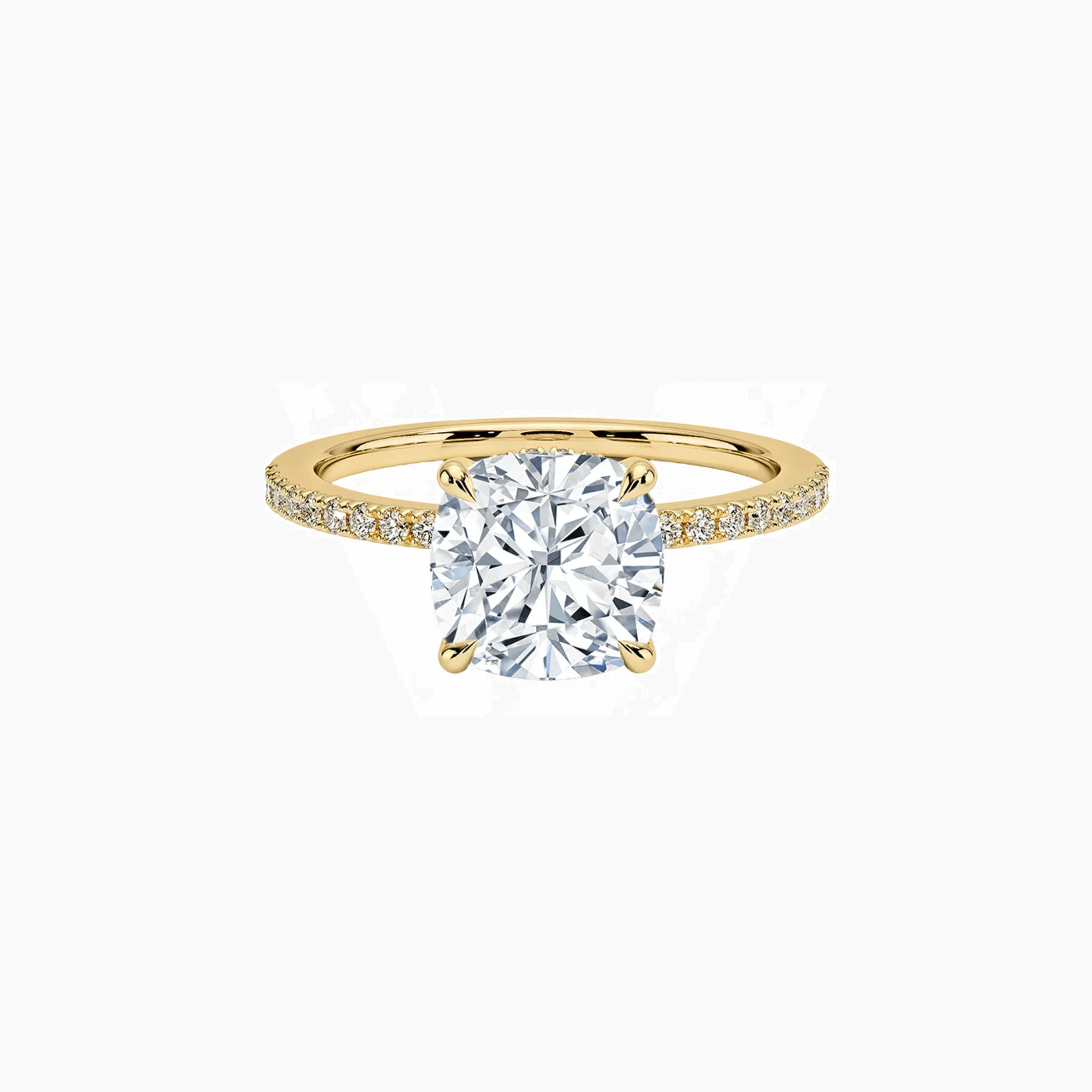 Cushion-cut moissanite hidden halo ring with pavé band in yellow gold vermeil, front view.