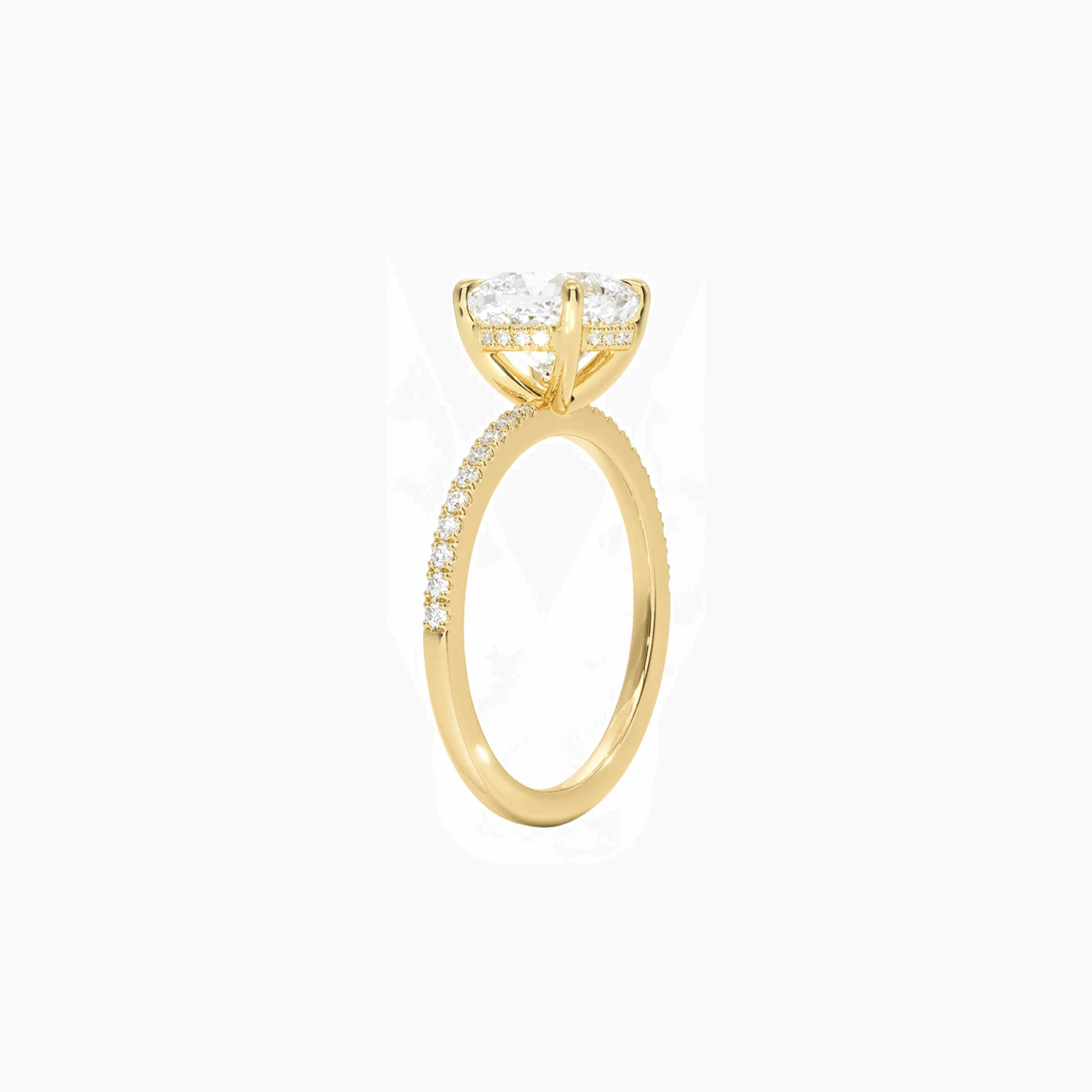 Cushion-cut moissanite hidden halo ring with pavé band in yellow gold vermeil, side view.
