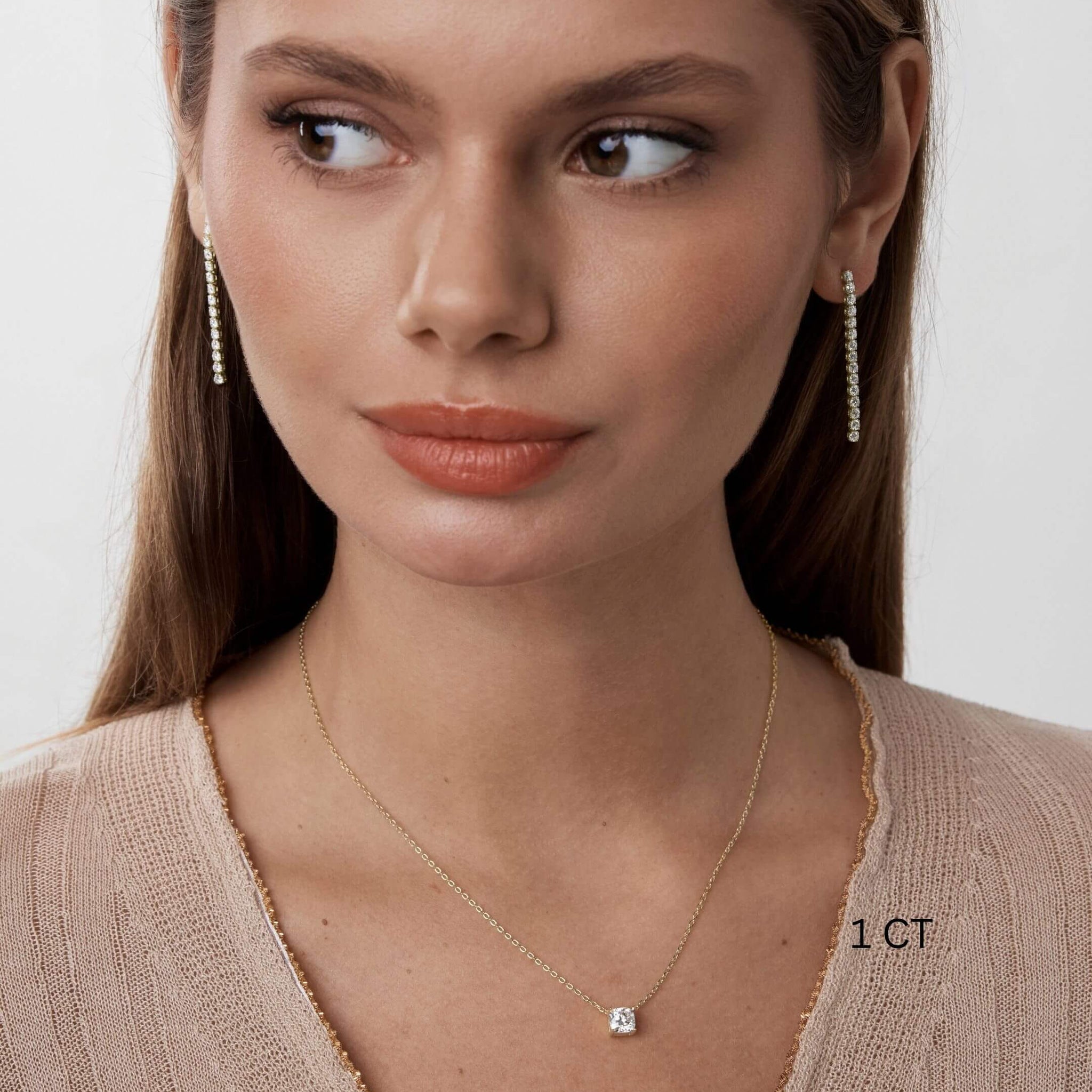 Cushion-cut moissanite pendant necklace worn at the neckline.