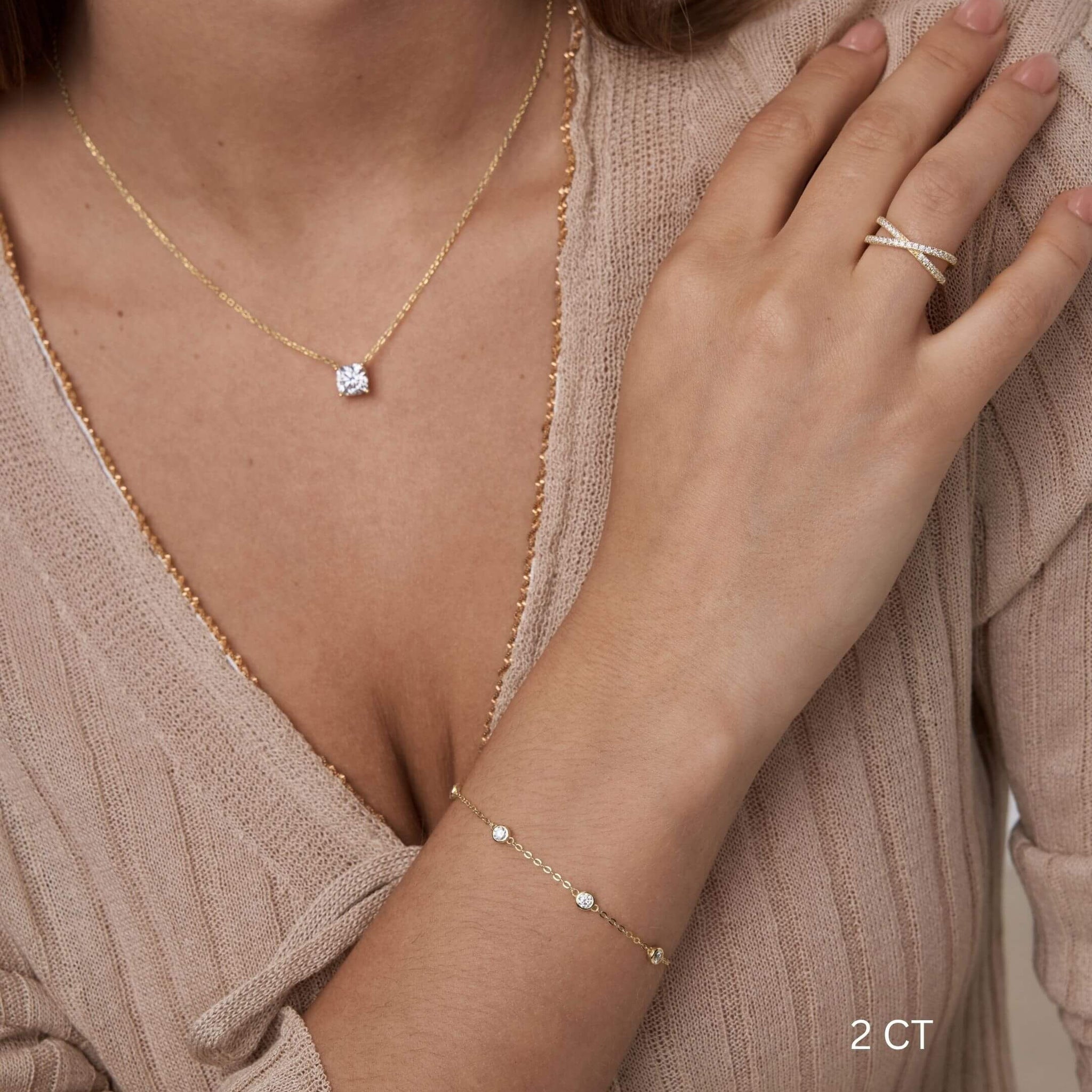 Cushion-cut moissanite pendant necklace worn at the neckline.