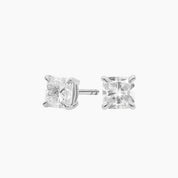 Cushion-cut moissanite stud earrings in white gold vermeil, front and side views.