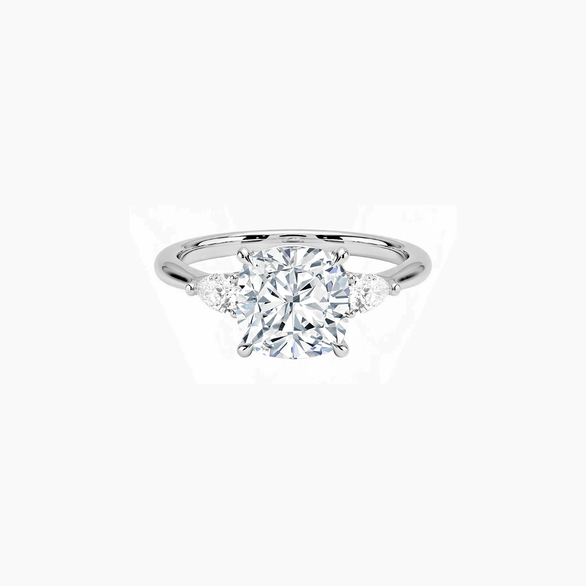 Cushion-cut moissanite three-stone ring in white gold vermeil, front view.