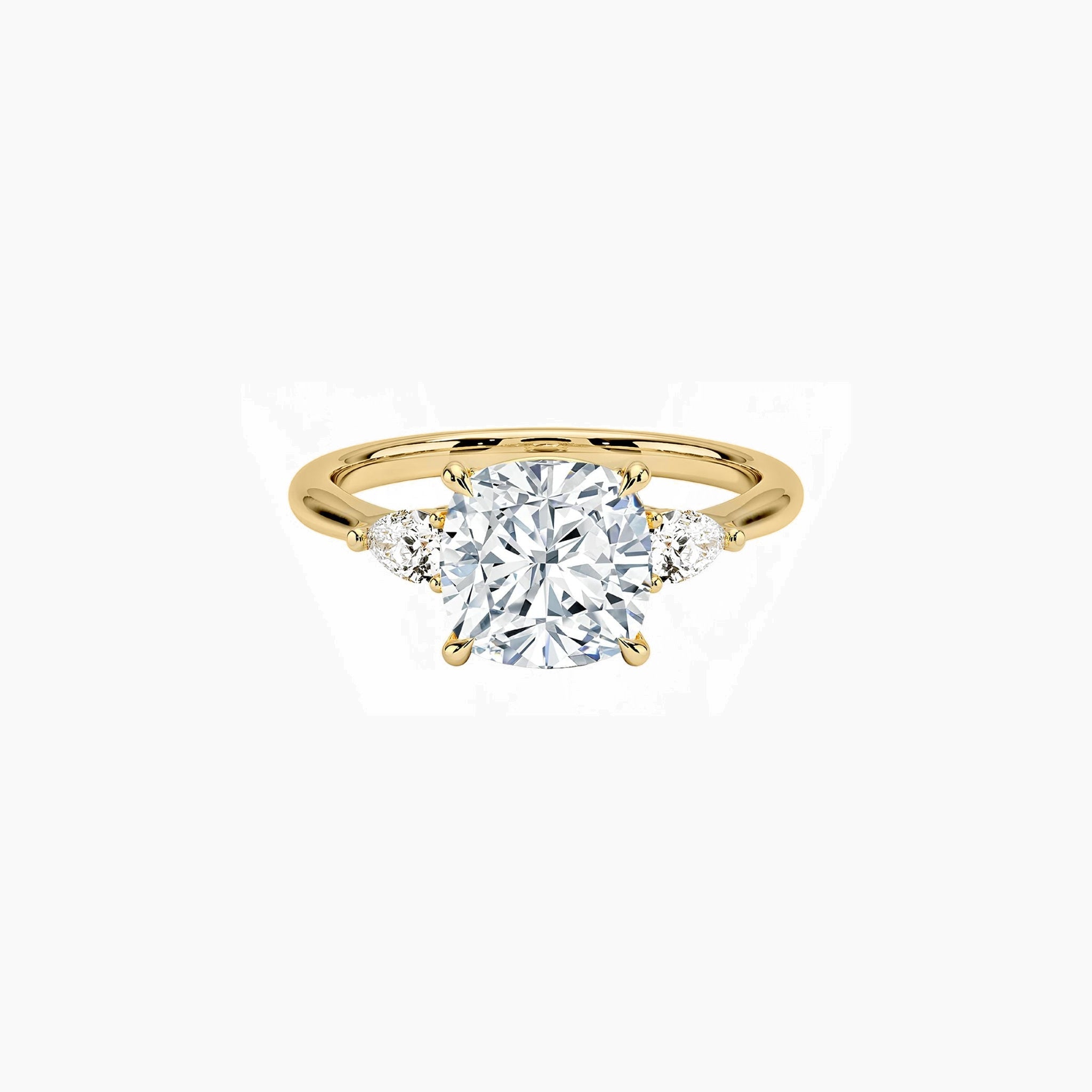 Cushion-cut moissanite three-stone ring in yellow gold vermeil, front view.