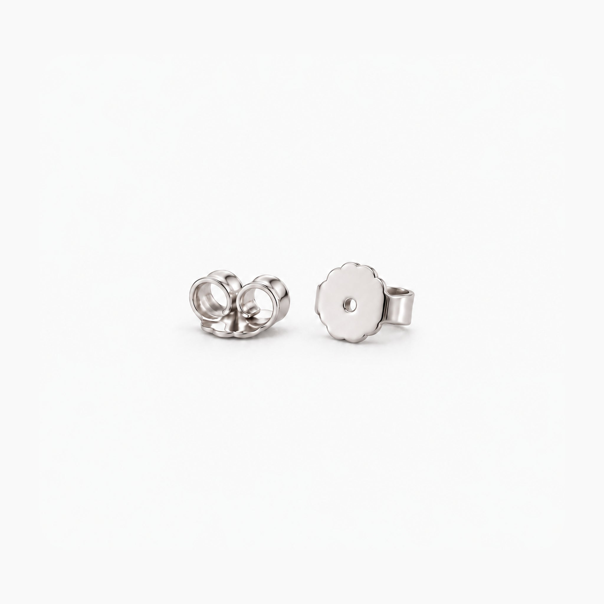 White gold vermeil butterfly earring backs, two studio detail views.