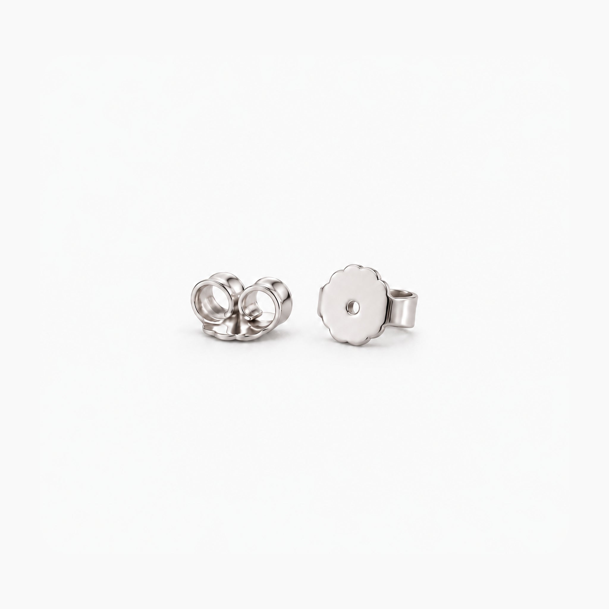 White gold vermeil butterfly earring backs, two studio detail views.