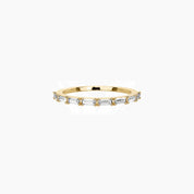 East-west emerald-cut moissanite half eternity ring in yellow gold vermeil, front view.