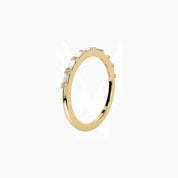 East-west emerald-cut moissanite half eternity ring in yellow gold vermeil, side view.