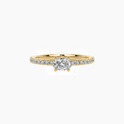 East-west oval-cut moissanite solitaire ring with pavé band in yellow gold vermeil, front view.