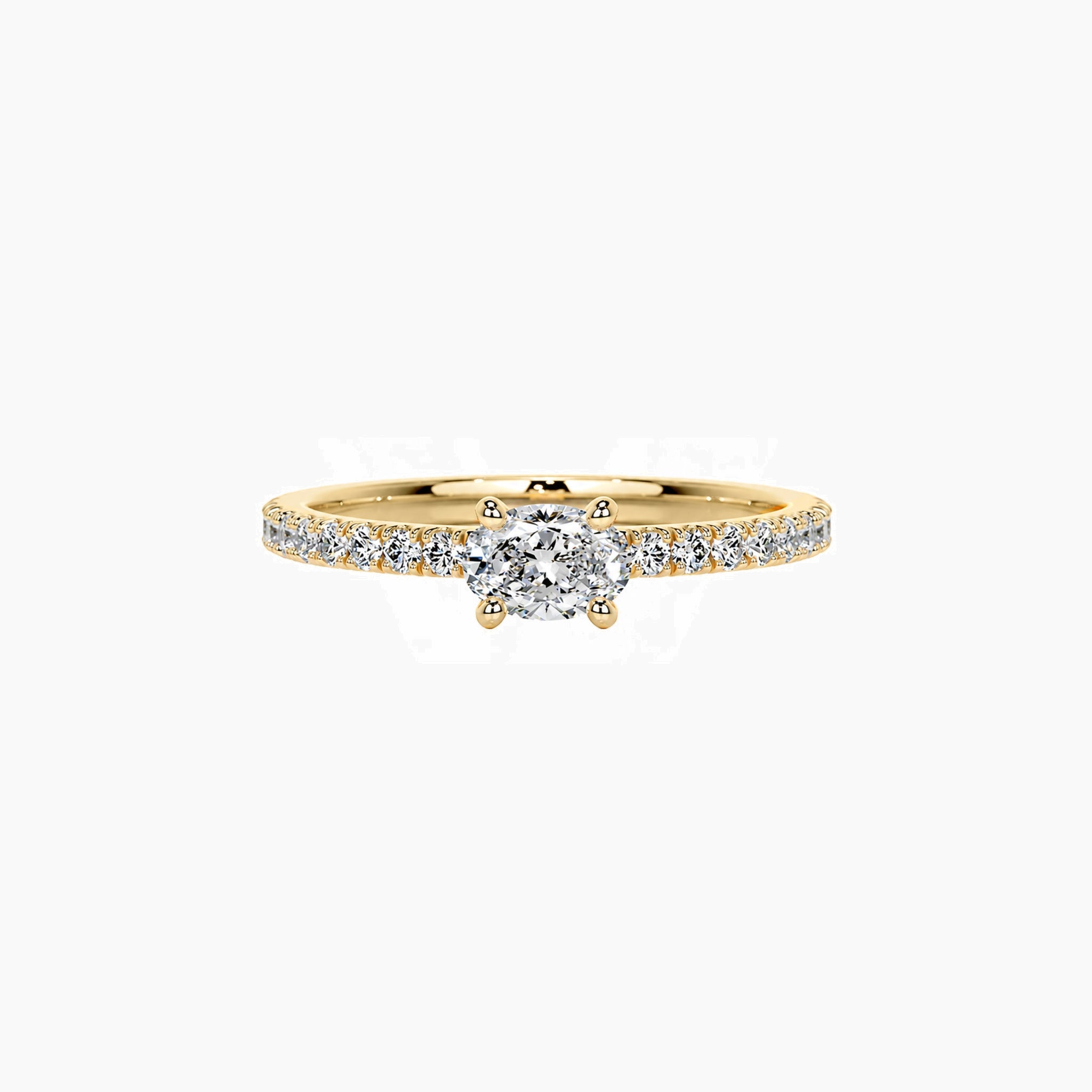 East-west oval-cut moissanite solitaire ring with pavé band in yellow gold vermeil, front view.