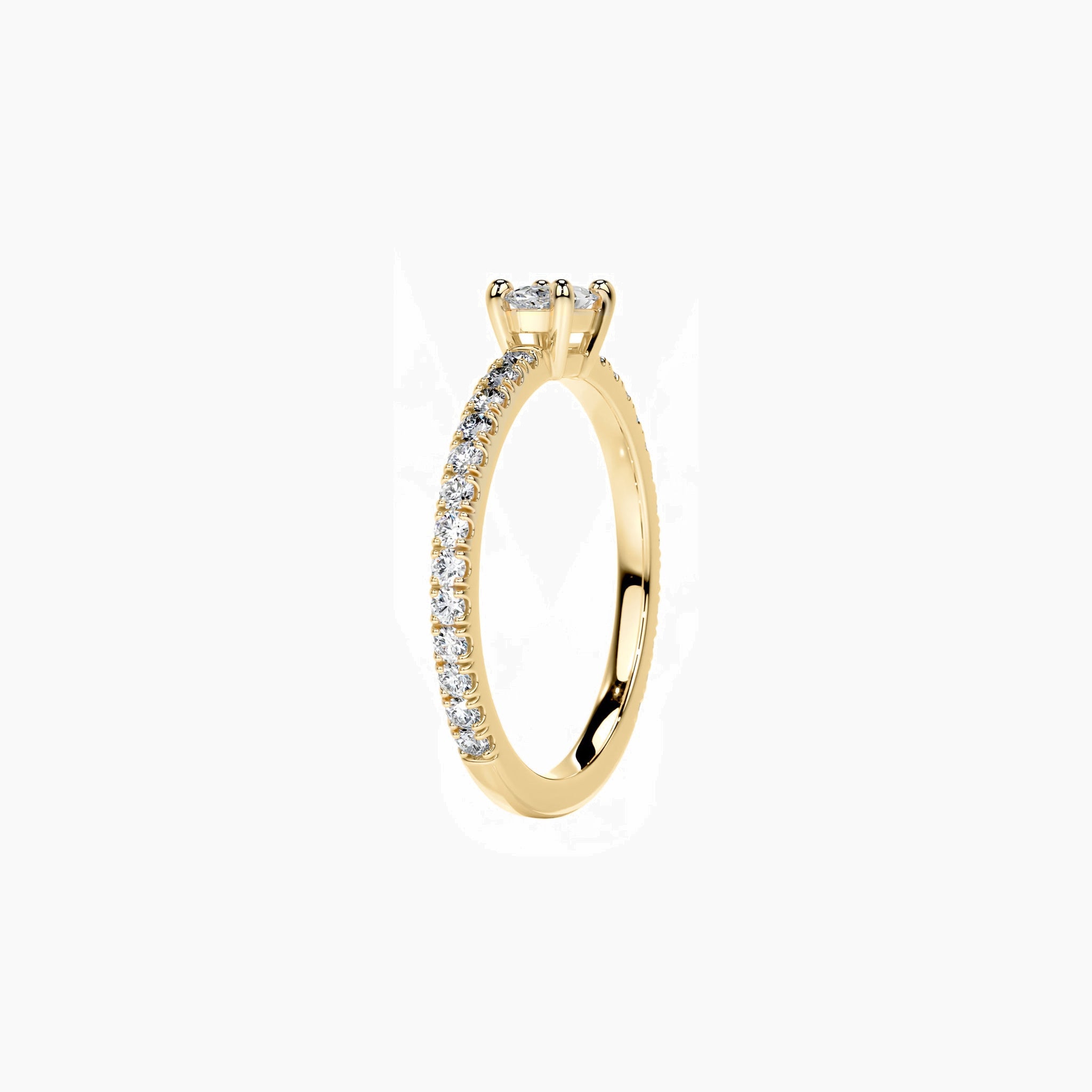East-west oval-cut moissanite solitaire ring with pavé band in yellow gold vermeil, side view.