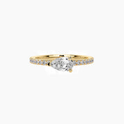 East-west pear-cut moissanite solitaire ring with pavé band in yellow gold vermeil, front view.