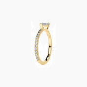 East-west pear-cut moissanite solitaire ring with pavé band in yellow gold vermeil, side view.