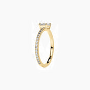 East-west radiant-cut moissanite solitaire ring with pavé band in yellow gold vermeil, side view.
