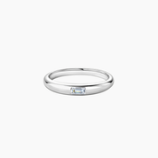 Emerald-cut moissanite bezel dome ring in white gold vermeil, front view.