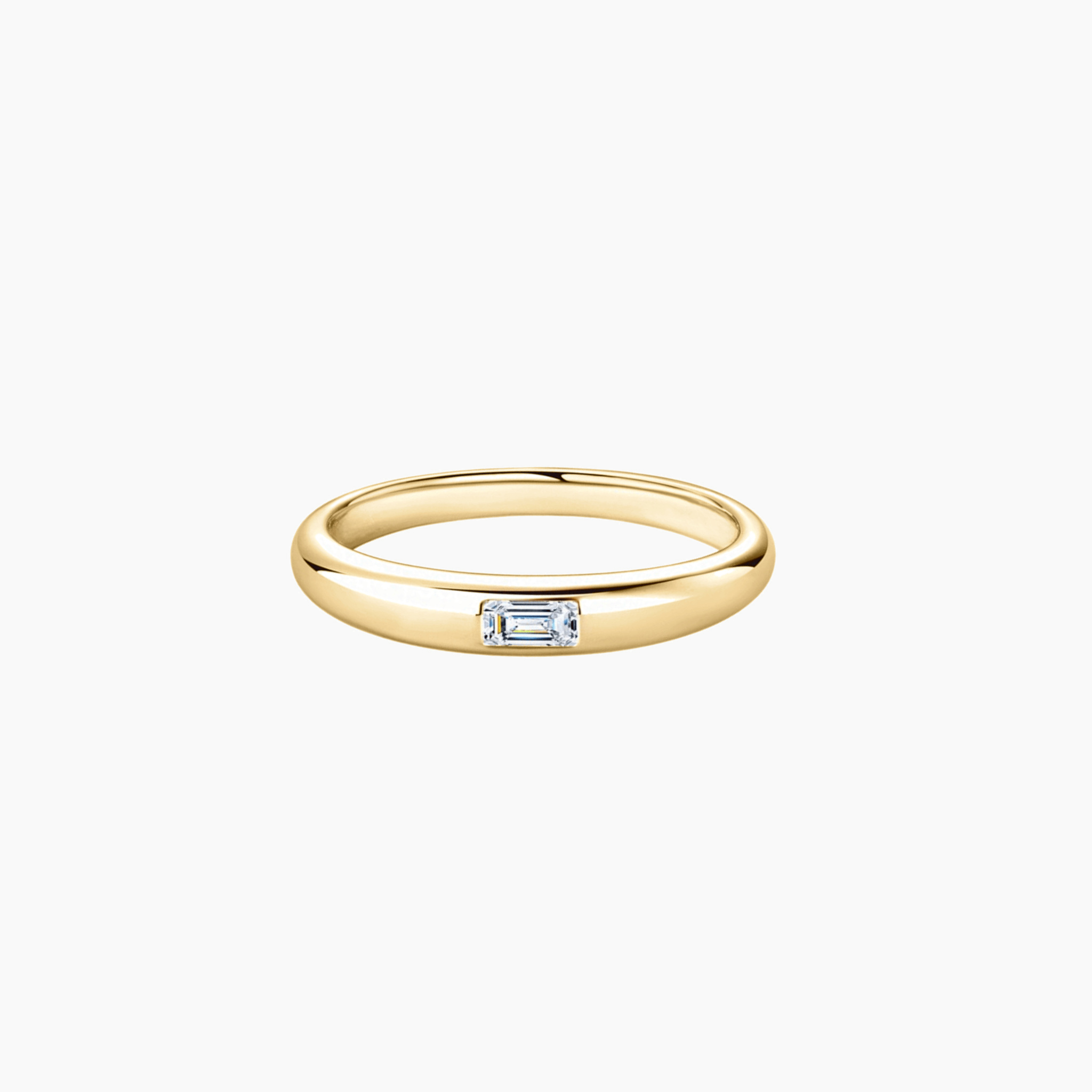 Emerald-cut moissanite bezel dome ring in yellow gold vermeil, front view.
