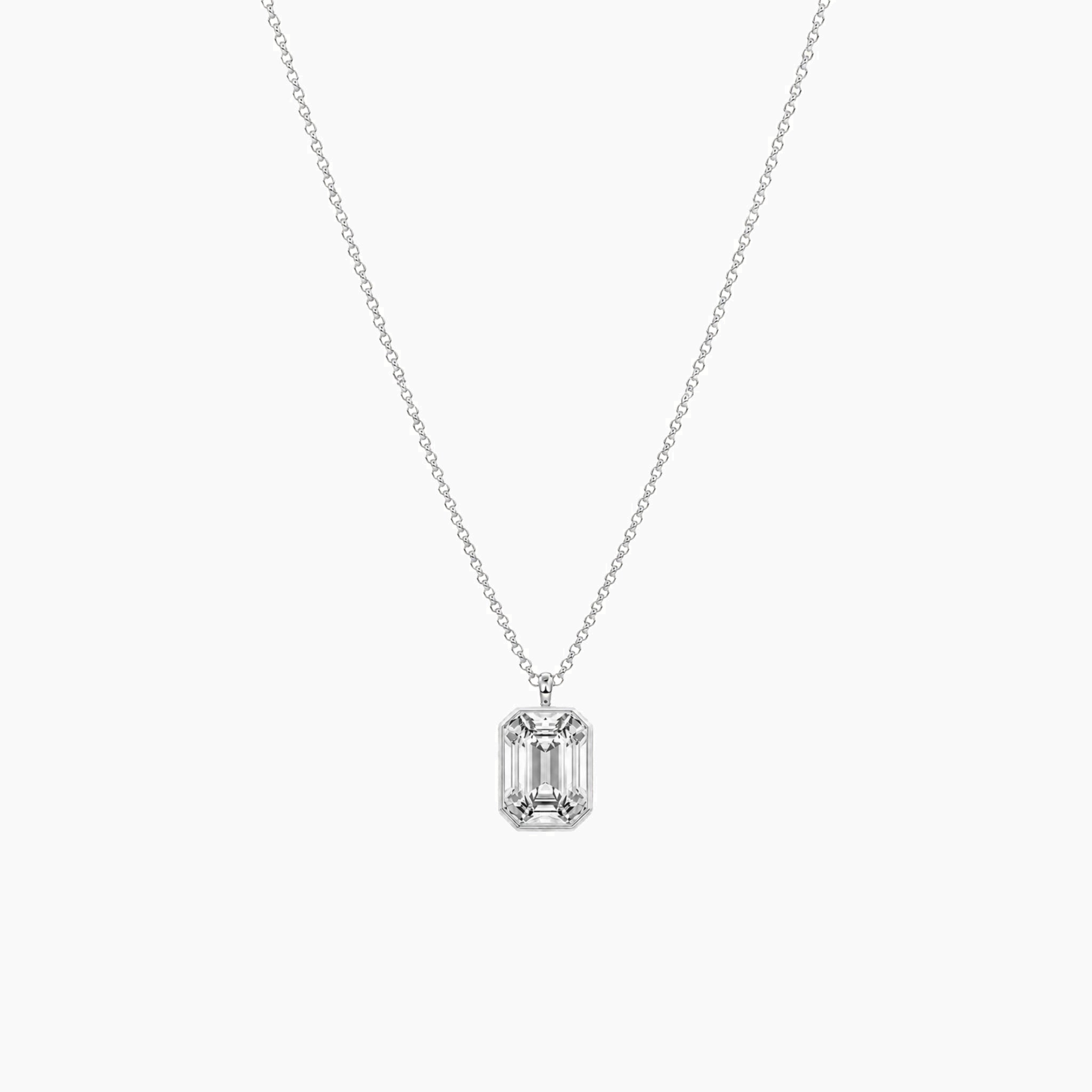 Emerald-cut moissanite bezel pendant necklace in white gold vermeil, full product view.
