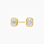 Emerald-cut moissanite bezel stud earrings in yellow gold vermeil, front and side views.