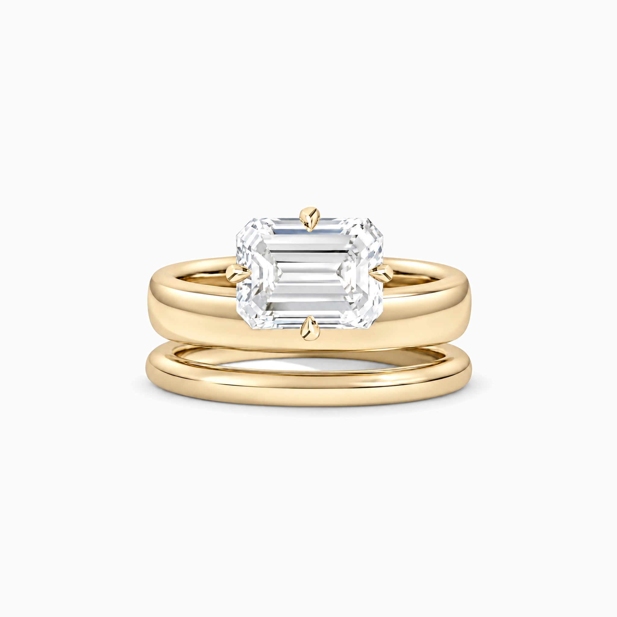 Emerald-cut moissanite double-band solitaire ring in yellow gold vermeil, front view.