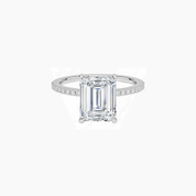 Emerald-cut moissanite hidden halo ring with pavé band in white gold vermeil, front view.