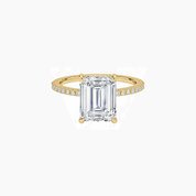Emerald-cut moissanite hidden halo ring with pavé band in yellow gold vermeil, front view.