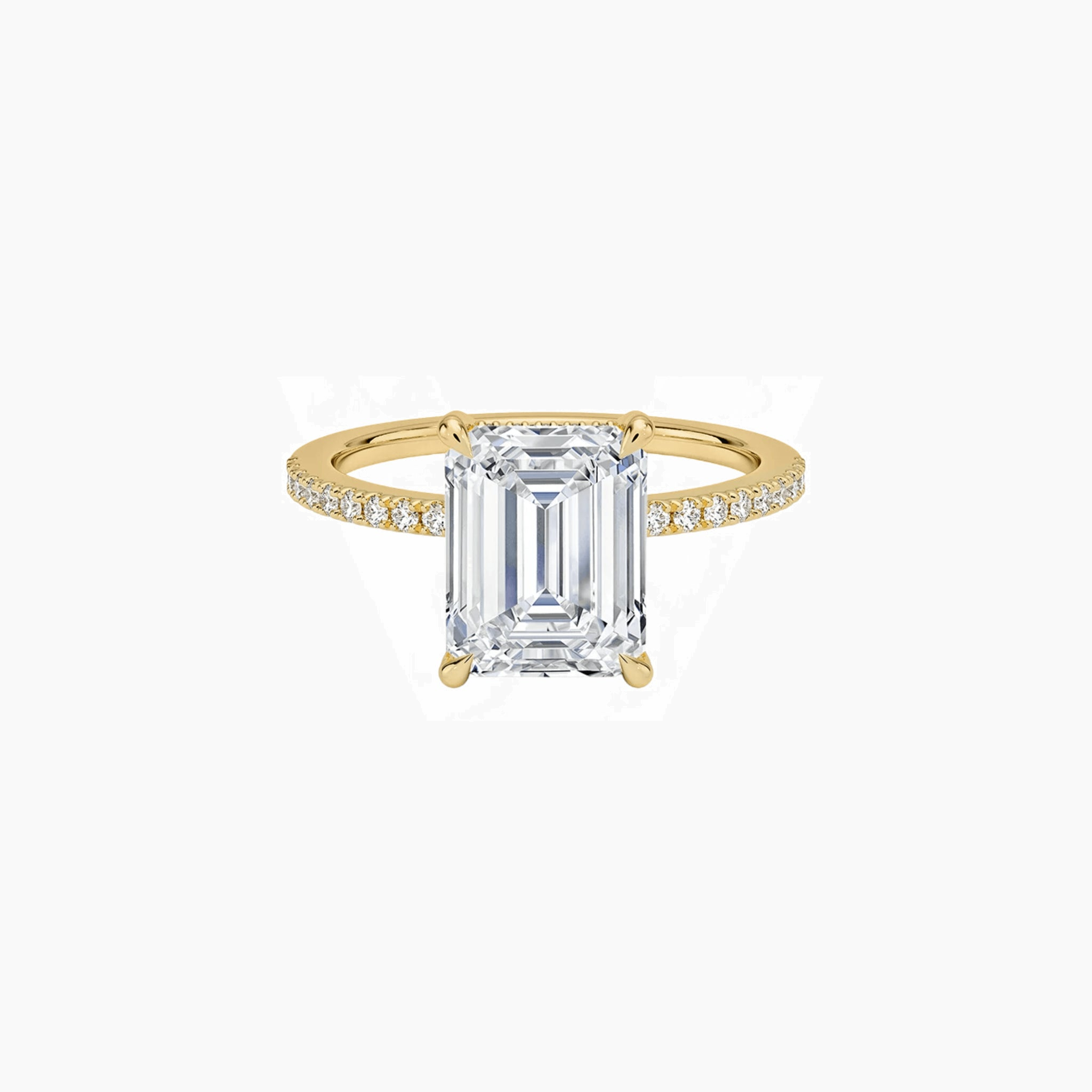Emerald-cut moissanite hidden halo ring with pavé band in yellow gold vermeil, front view.