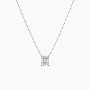 Emerald-cut moissanite pendant necklace in white gold vermeil, front view.