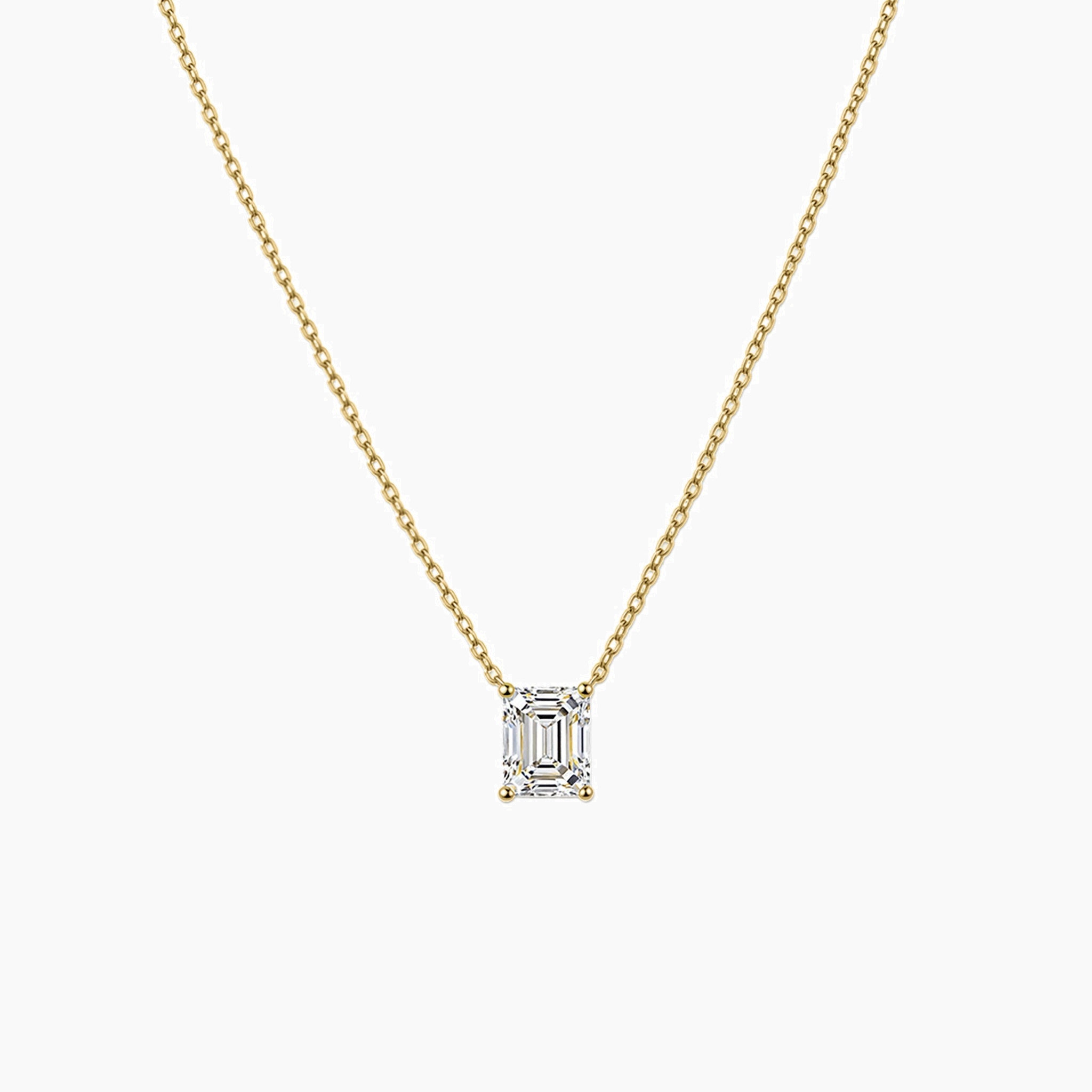 Emerald-cut moissanite pendant necklace in yellow gold vermeil, front view.