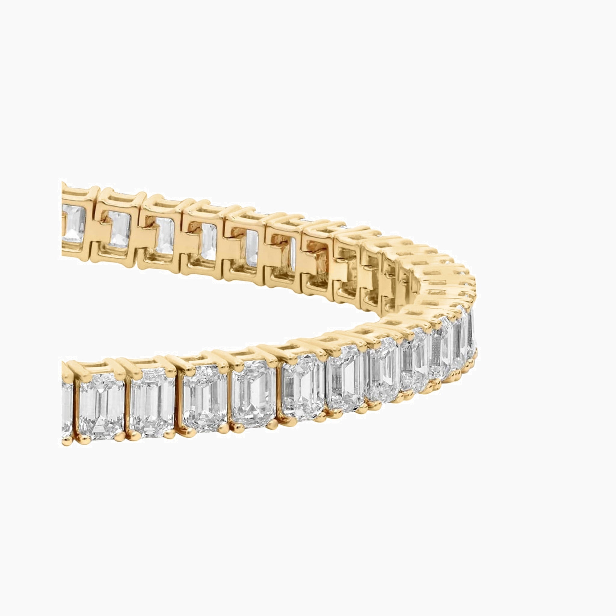 Emerald-cut moissanite tennis bracelet in yellow gold vermeil, close-up detail.