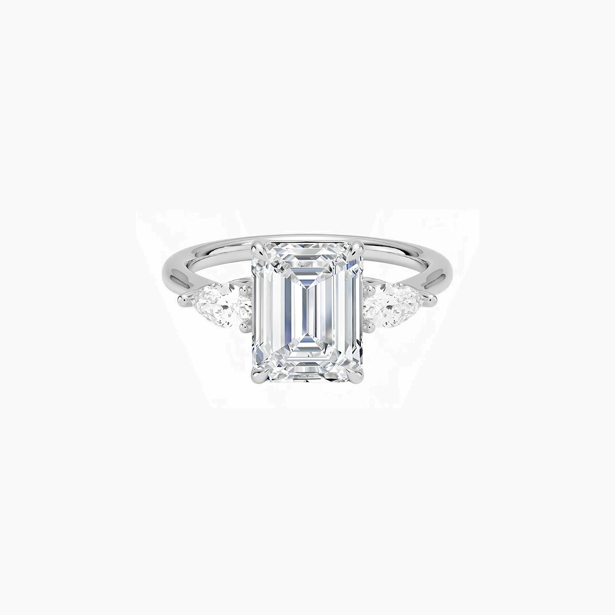 Emerald-cut moissanite three-stone ring in white gold vermeil, front view.