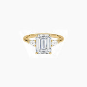 Emerald-cut moissanite three-stone ring in yellow gold vermeil, front view.